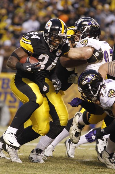Rashard Mendenhall (34), a bruising presence for the Pittsburgh Steelers as they advanced to the Super Bowl, keeps his teammates laughing off the field. (Associated Press)