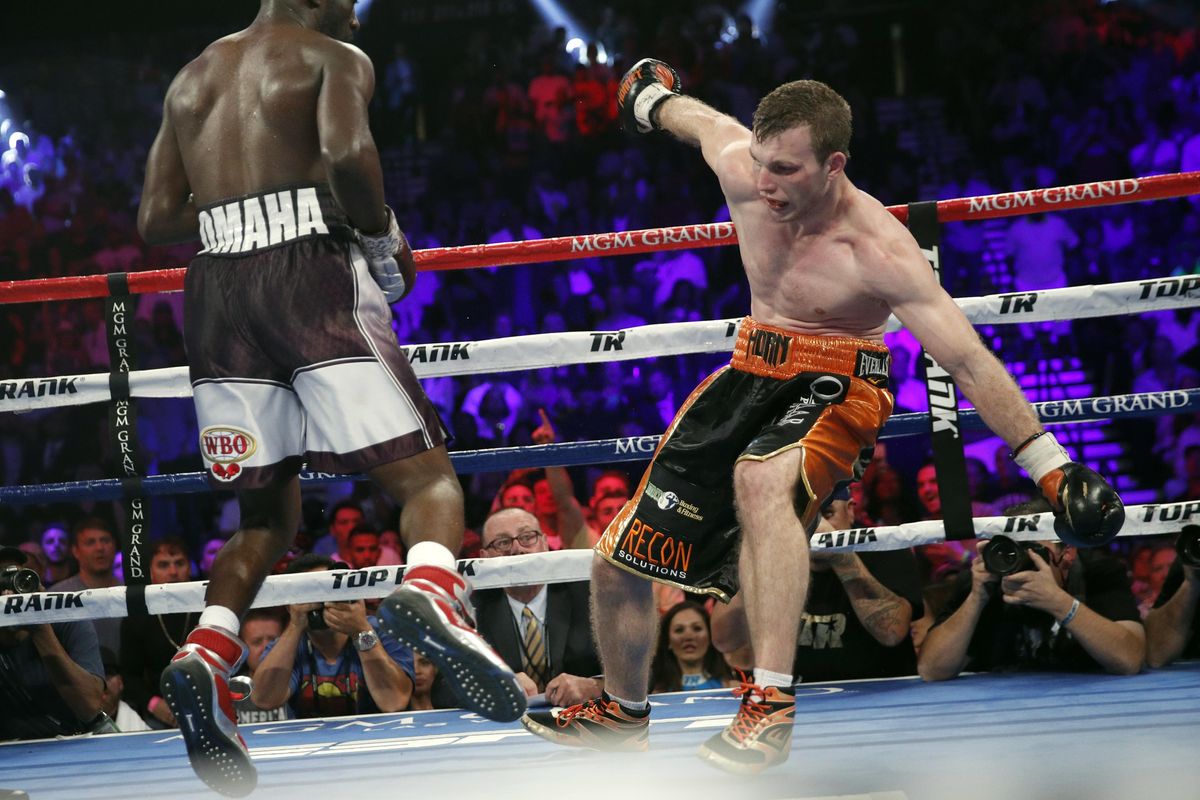 Terence Crawford, left, knocks Jeff Horn, of Australia, off his balance during their welterweight title boxing match, Saturday, June 9, 2018, in Las Vegas. (John Locher / Associated Press)