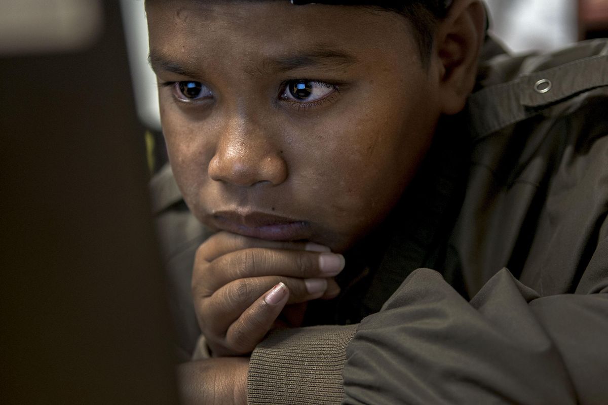 Marshallese student Ringo Jack Jr. studies during English Language Learners class at Garry Middle School in Spokane on Tuesday, March 28, 2017. (Kathy Plonka / The Spokesman-Review)