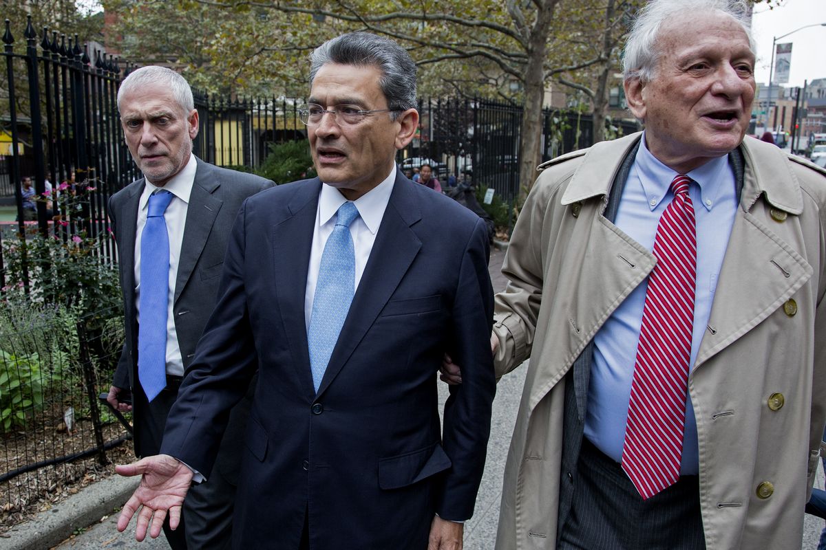 Former Goldman Sachs and Procter & Gamble Co. board member Rajat Gupta, center, arrives outside court in New York Wednesday, Oct. 24, 2012. Gupta is to be sentenced after being found guilty insider trading by passing secrets between March 2007 and January 2009 to a billionaire hedge fund founder who used the information to make millions of dollars. At right is Gupta's attorney Gary Naftalis. (Craig Ruttle / Fr61802 Ap)