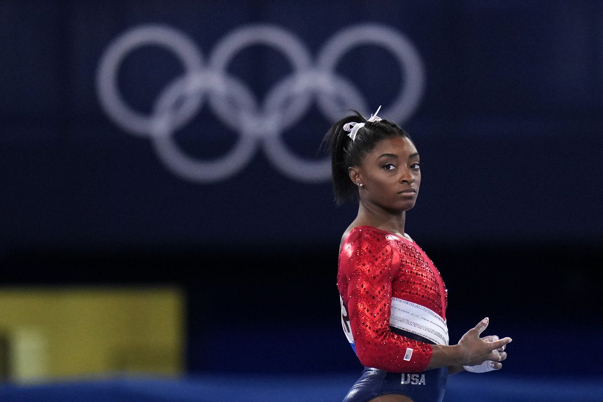 File-This July 27, 2021, file photo shows Simone Biles, of the United States, waiting to perform on the vault during the artistic gymnastics women