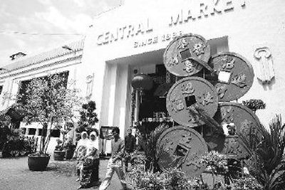 
Malaysian Muslims walk out of the Central Market decorated for the upcoming Chinese New Year in Kuala Lumpur.
 (Associated Press / The Spokesman-Review)