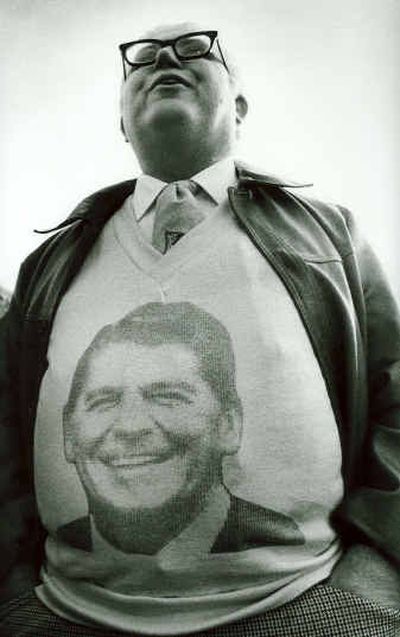 
A Ronald Reagan supporter wears a likeness of the president on his sweater while waiting outside the Spokane Coliseum for an Oct. 31, 1986, visit from Reagan. 
 (Dan Pelle / The Spokesman-Review)