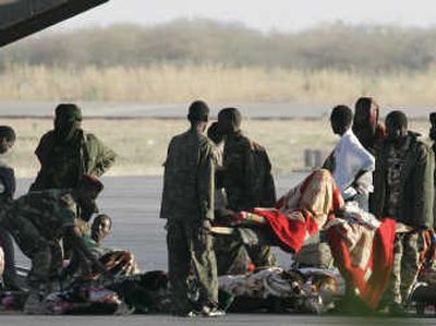 
Wounded government soldiers at the N'djamena airport prepare for evacuation to Libya for medical treatment on Tuesday. Thousands of Chadians have fled the capital during the uprising. Associated Press
 (Associated Press / The Spokesman-Review)