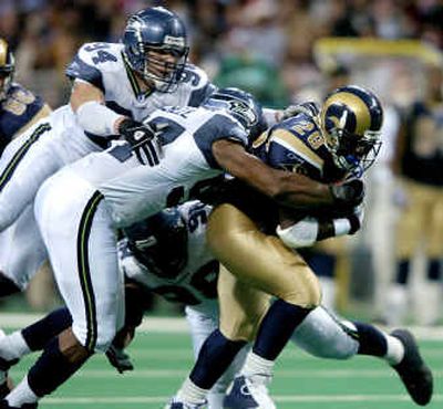 
St. Louis' Marshall Faulk (28) carried 28 times for 85 yards the last time the Rams faced the Seahawks. His play in the fourth quarter helped seal a 27-22 win.
 (Associated Press / The Spokesman-Review)