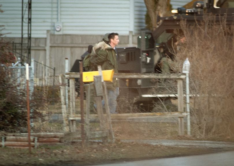 After a three-hour standoff, suspected gunman Ryan Lancaster, 39, surrenders to the Spokane County SWAT team that surrounded a home he had entered near the intersection of North Pines Road and Valleyway on Wednesday afternoon. (Colin Mulvany)