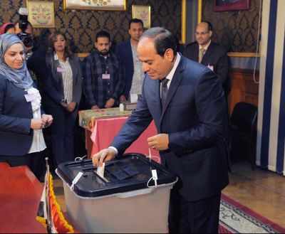 Egyptian President Abdel-Fattah el-Sissi votes March 26, 2018, in Cairo, Egypt. On Sunday. May 13, 2018, a top newspaper editor known to be close to el-Sissi subtly suggested that the Egyptian leader be allowed to rule beyond the maximum two, four-year terms set by the constitution. (MENA)