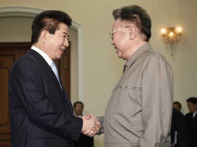 
South Korean President Roh Moo-hyun, left, shakes hands with North Korean leader Kim Jong Il before their meeting   today in Pyongyang, North Korea. Associated Press
 (Associated Press / The Spokesman-Review)