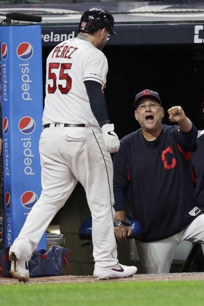 Cleveland Indians’ Roberto Perez, left, is congratulated by Cleveland Indians manager Terry Francona after Perez hit a solo home run during the sixth inning of the team’s baseball game against the Houston Astros, Wednesday, July 31, 2019, in Cleveland. (Tony Dejak / Associated Press)