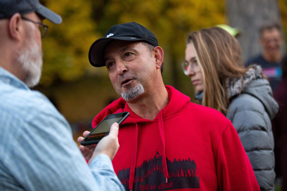 Dempsey Ortega, head coach for North Central’s girls cross country team, gives an interview following a Greater Spokane League meet at Manito Park on Oct. 17, 2018. Ortega was named UST&F girls cross country coach of the year. (Libby Kamrowski / The Spokesman-Review)