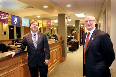 Director Breean Beggs, left, and founder Jim Sheehan stand in the lobby of the Center for Justice,  in Spokane’s Community Building.  (Jesse Tinsley / The Spokesman-Review)