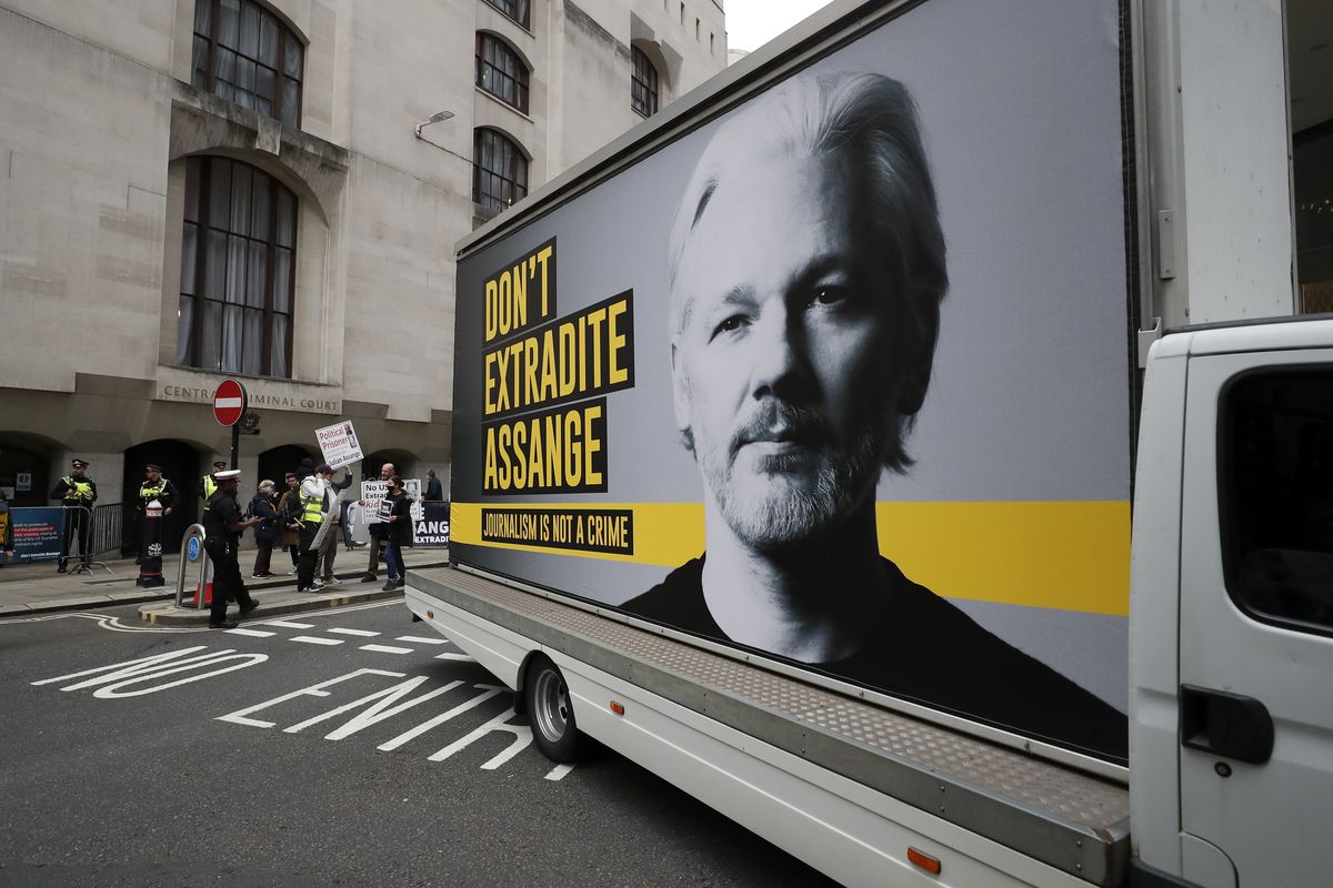 A van with a protest poster passes the Central Criminal Court Old Bailey in London, Monday, Sept. 7, 2020. Lawyers for WikiLeaks founder Julian Assange and the U.S. government were squaring off in a London court on Monday at a high-stakes extradition case delayed by the coronavirus pandemic. American prosecutors have indicted the 49-year-old Australian on 18 espionage and computer misuse charges over Wikileaks’ publication of secret U.S. military documents a decade ago. The charges carry a maximum sentence of 175 years in prison. (Frank Augstein)