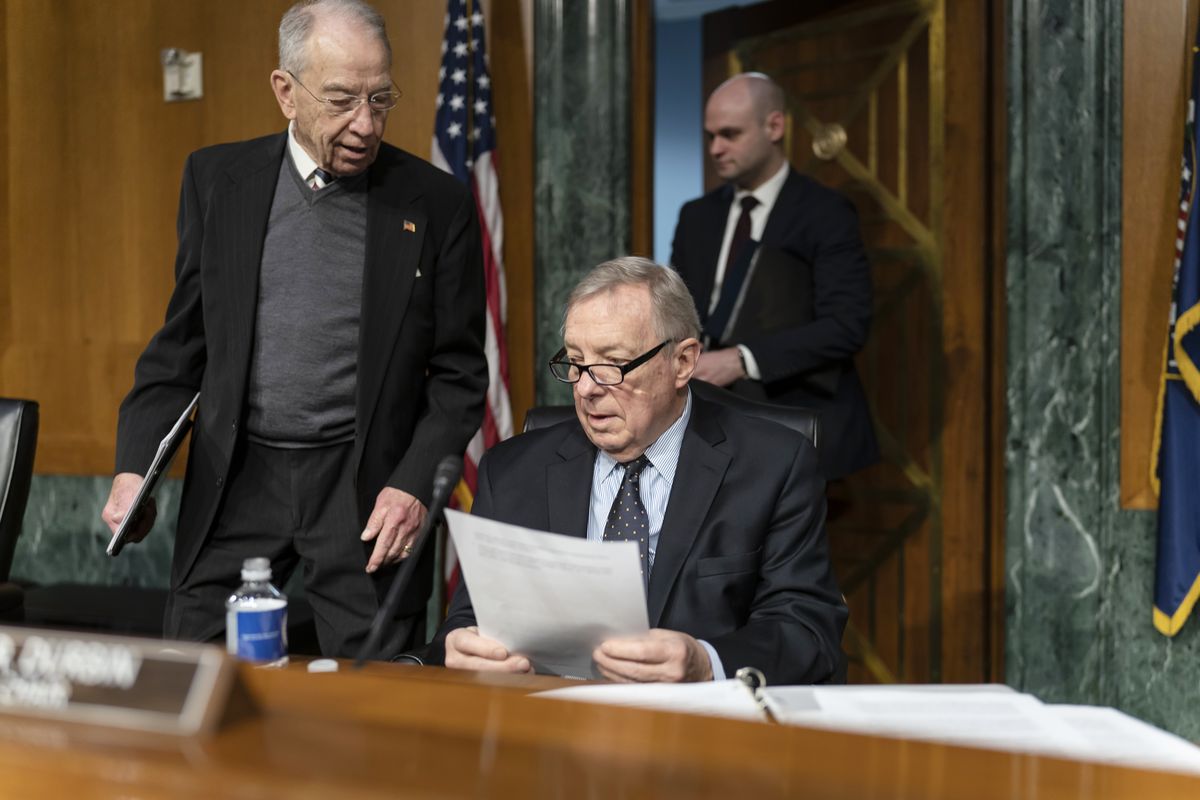 FILE - Sen. Chuck Grassley, R-Iowa, left, the ranking member, confers with Sen. Dick Durbin, D-Ill., chairman of the Senate Judiciary Committee, at the Capitol in Washington, Feb. 17, 2022. The leaders of the Senate Judiciary Committee are demanding Attorney General Merrick Garland take immediate action to reform the beleaguered federal Bureau of Prisons. It comes in response to Associated Press investigations that exposed widespread problems at the bureau, serious misconduct involving correctional officers and rampant sexual abuse at a California women’s prison.  (J. Scott Applewhite)