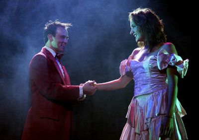 
Ross Cornell, starring as Ren, gives Cara Cooley, who plays Ariel, a wrist corsage. Both star in Coeur d'Alene Summer Theatre's production of 