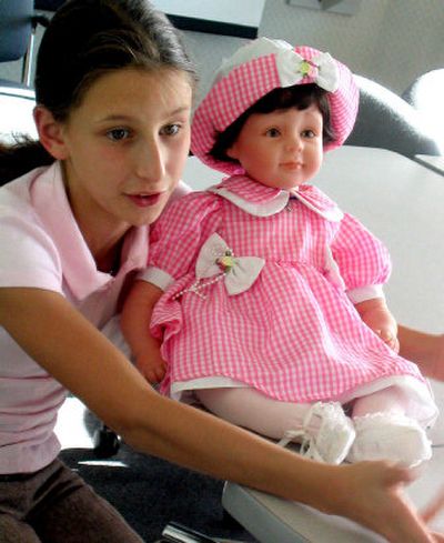 
Mikinzie Hourlland, 11, of Hayden, made a doll she hopes to raffle for Hurricane Katrina relief. 
 (Rasha Madkour / The Spokesman-Review)