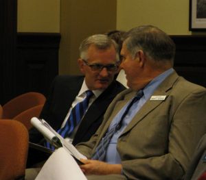 Defense attorney Chuck Peterson, left, confers with Sen. Monty Pearce, R-New Plymouth, right, during a Senate ethics committee meeting Monday morning on an ethics complaint against Pearce. (Betsy Russell)