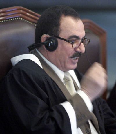 
Chief judge Abdullah al-Amiri addresses the court during the trial of former Iraqi President Saddam Hussein on Thursday. 
 (Associated Press / The Spokesman-Review)