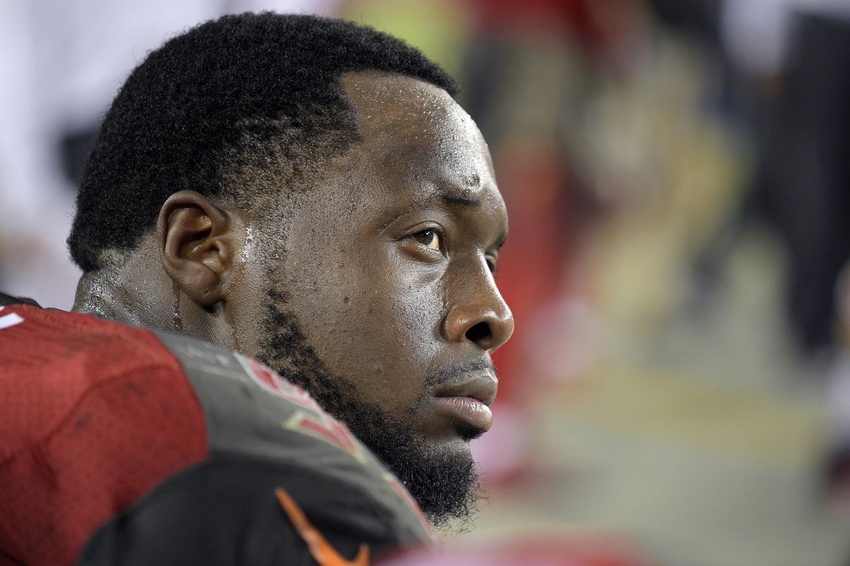 In this Nov. 8, 2015, file photo, Tampa Bay Buccaneers defensive tackle Gerald McCoy watches from the sideline during the first half of an NFL football game against the New York Giants in Tampa, Fla. McCoy said he, his father and his wife have all been victims of racial profiling , even after he became a successful athlete. (Phelan M. Ebenhack / AP)