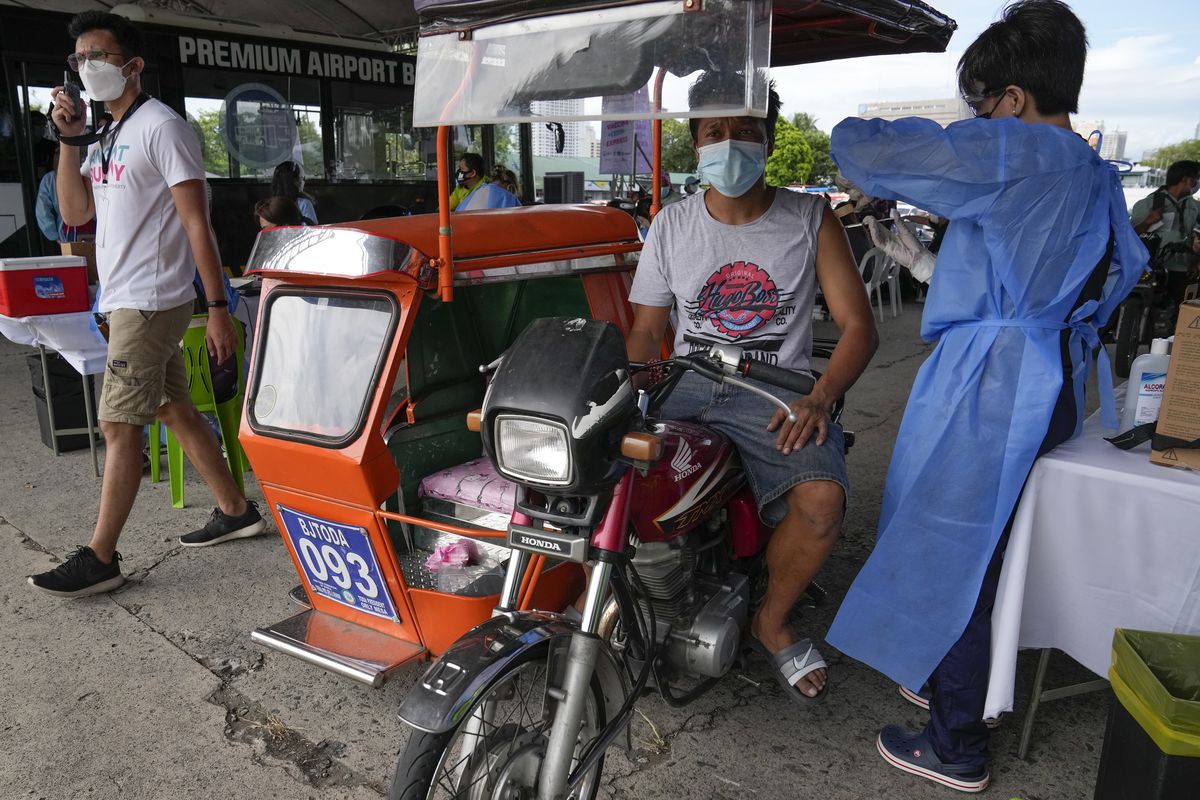 A pedicab driver is inoculated with China
