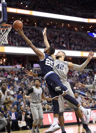 Villanova guard Mikal Bridges (25) drives to the basket against Georgetown center Bradley Hayes (42) during Saturday’s game. (Nick Wass / Associated Press)