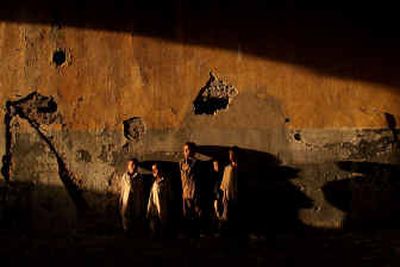 
Afghan refugee children play in an old building destroyed during the civil war in Kabul, Afghanistan, on Saturday. 
 (Associated Press / The Spokesman-Review)
