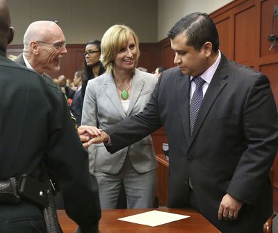George Zimmerman, right, is congratulated by his defense team after being found not guilty during  Zimmerman's trial in Seminole circuit court in Sanford, Fla. on Saturday, July 13, 2013. Jurors found Zimmerman not guilty of second-degree murder in the fatal shooting of 17-year-old Martin in Sanford, Fla. The six-member, all-woman jury deliberated for more than 15 hours over two days before reaching their decision Saturday night. (Gary Green / Orlando Sentinel Pool)