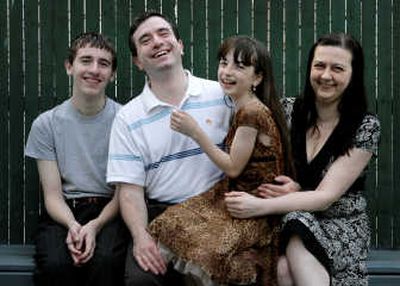 
The Pinskiy family poses for a picture at their home in New York in  April. From left to right, Eugene, 14, Lev, Margaret, 9, and Viktoriya. Lev sends his children to Camp Quest because he wants them to have a sense of belonging. Associated Press
 (Associated Press / The Spokesman-Review)