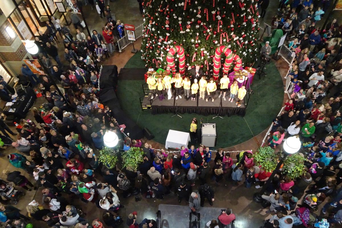 Several hundred merrymakers await the arrival of Santa Claus at River Park Square mall in downtown Spokane Friday, Nov. 18, 2016. Stores hired about 500 seasonal workers last month, boosting employment in the Spokane area. (Jesse Tinsley / The Spokesman-Review)