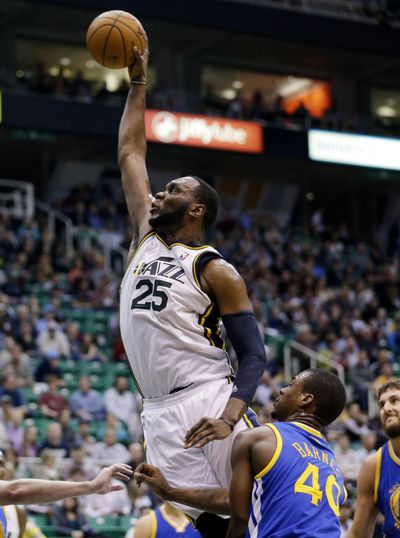 Utah’s Al Jefferson dunks for two of his 24 points against Golden State. (Associated Press)