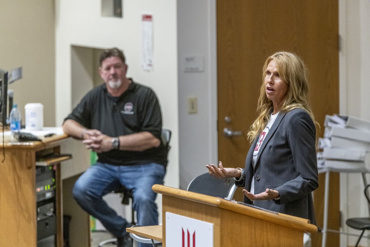Kym Hilinski, right, speaks to Whitworth University student-athletes on Wednesday. She and her husband, Mark, seated at left, tour the country to share the story of losing their son, former Washington State quarterback Tyler, to suicide in 2018. The Hilinskis make it a point not to avoid any of the painful questions that follow a suicide.  (Jesse Tinsley/THE SPOKESMAN-REVI)
