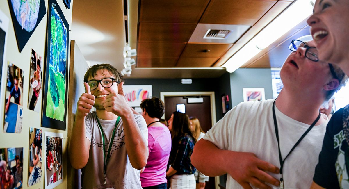 Shadle Park senior Wyatt Antcliff, left, is one of the high school artists whose work is on display at the MAC, pictured Friday. (Kathy Plonka/The Spokesman-Review)