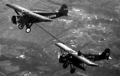 
The Spokane Sun God, with Nick Mamer and Art Walker as pilots, is refueled over Mills Field in San Francisco in August  1929 during the first nonstop transcontinental flight. The refueling plane is the Californian piloted by Donald Templeman.
 (File/ / The Spokesman-Review)