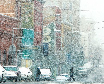 Large snowflakes fall on uptown Butte, Mont. on West Broadway Street Tuesday morning, April 13, 2010. The wet and heavy snow started falling early in the day and had covered most of Western Montana with 3-6 inches by night fall and was a record for this day. (Walter Hinick / Montana Standard)