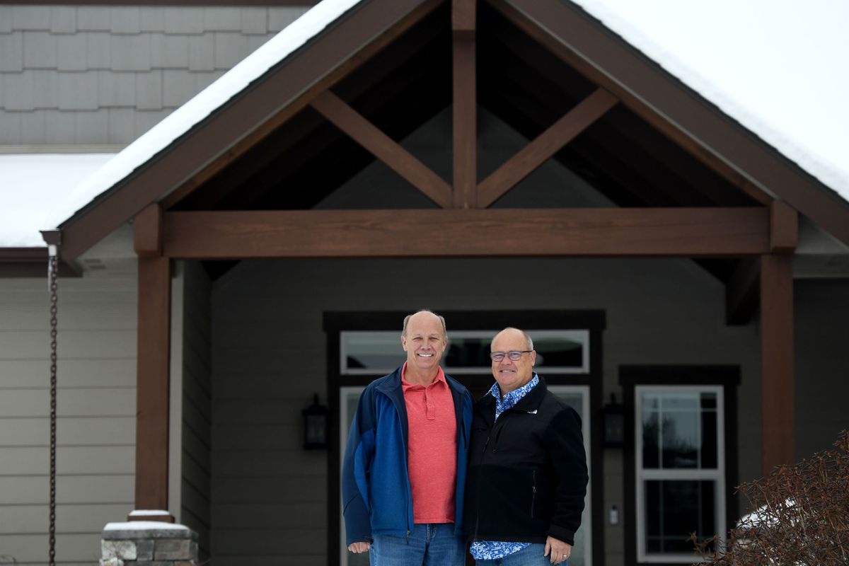 Con Mealey, left, and his husband Greg Richards are photographed in front of their Post Falls home on Monday. They got married 10 years ago when same-sex marriage became legal in Washington.  (Kathy Plonka/The Spokesman-Review)