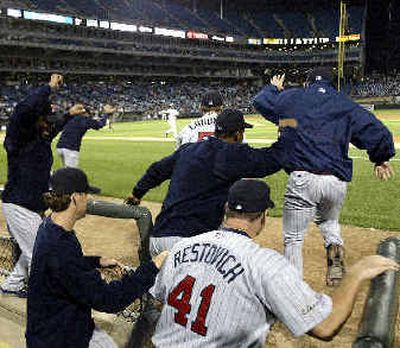 
Minnesota Twins players and coaching staff members run to the field to celebrate the A.L. Central title Monday.Minnesota Twins players and coaching staff members run to the field to celebrate the A.L. Central title Monday.
 (Associated PressAssociated Press / The Spokesman-Review)