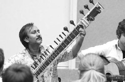 
Sandip Burman, a native of Durgapur, India, plays the sitar  at University High School as he leads music students in an interactive clinic featuring  the sitar and the tabla (Indian drums).
 (J. BART RAYNIAK / The Spokesman-Review)