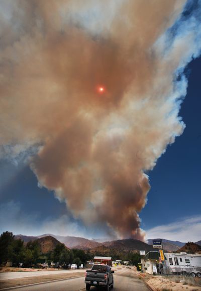 The Shirley fire kicks up smoke with the sun in the center in Wofford Heights, Calif., on Sunday. (Casey Christie)