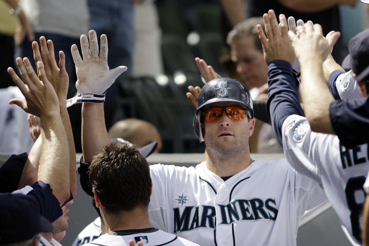 Seattle Mariners slugger Russell Branyan is congratulated following his sixth-inning grand slam against the Tampa Bay Rays. (Associated Press / The Spokesman-Review)
