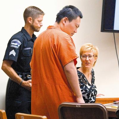 John Lee joins his attorney, Deborah McCormick, after being escorted into Latah County 2nd District Court. (Geoff Crimmins / Moscow-Pullman Daily News)