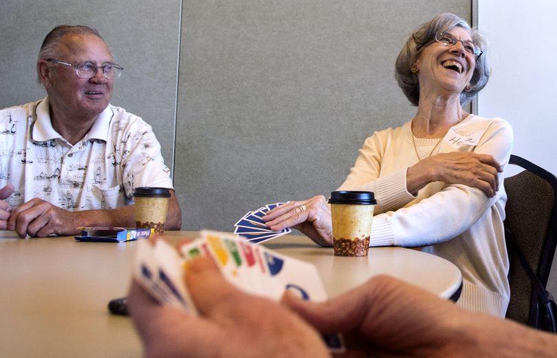 Bob Krall, left, and Helen Bogdanowicz enjoy a card game at the Kroc Center in Coeur d’Alene on April 20, 2016. The center hosts senior group activities on Wednesdays. (Kathy Plonka / The Spokesman-Review)