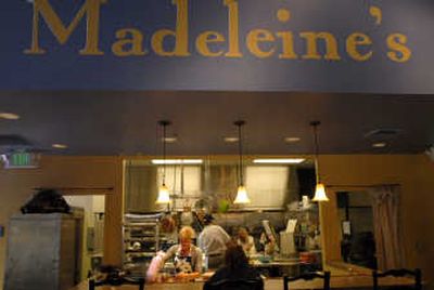 
Megan Poffenroth of Madeleine's Café in downtown Spokane works in the kitchen, creating desserts and meals. 
 (Brian Plonka / The Spokesman-Review)