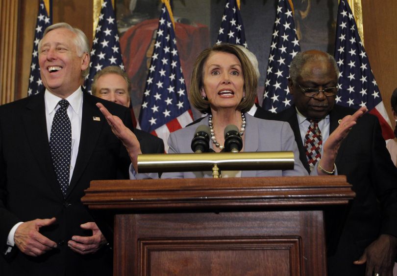 Speaker Nancy Pelosi of California gestures during a press conference after the House passes health care reform in the U.S. Capitol in Washington, Monday, Sunday 21, 2010. Standing with Speaker Pelosi are Majority Leader Steny Hoyer of Maryland, left, and Rep. James Clyburn, D-S.C. (Charles Dharapak / Associated Press)