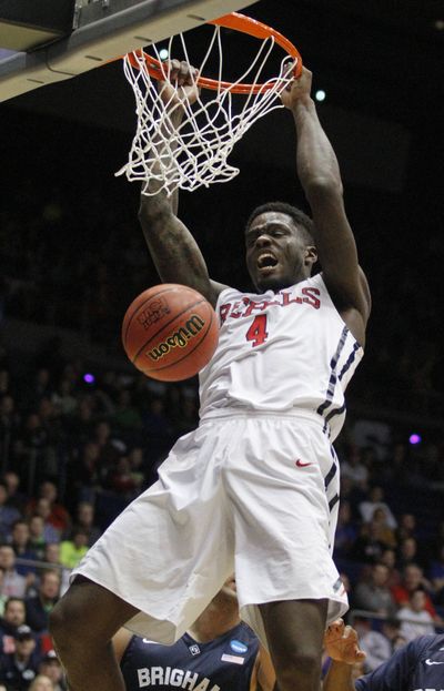 Mississippi’s M.J. Rhett dunks for two of his 20 points on Tuesday. (Associated Press)