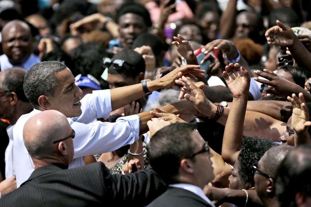 President Barack Obama greets supporter after speaking at a campaign event at Norfolk State University, Tuesday, Sept. 4, 2012, in Norfolk, Va. (Pablo Monsivais / Associated Press)