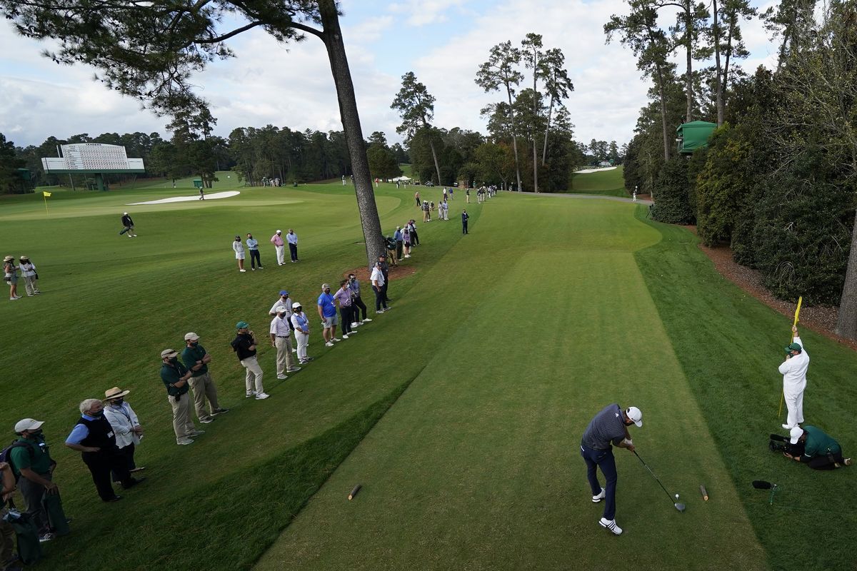 FILE – Dustin Johnson tees off on the 18th hole during the final round of the Masters golf tournament in Augusta, Ga., in this Sunday, Nov. 15, 2020, file photo. The Masters was among seven majors for men and women this year, none selling tickets to the public. (David J. Phillip)