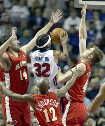 Detroit's Richard Hamilton tries to take a shot against the triple defense of the Atlanta Hawks.
(Associated Press / The Spokesman-Review)