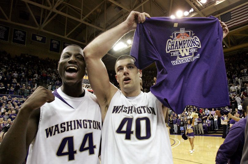 Washington senior Jon Brockman (40) celebrates with freshman Darnell Gant after the team beat Washington State. (Elaine Thompson / Associated Press)