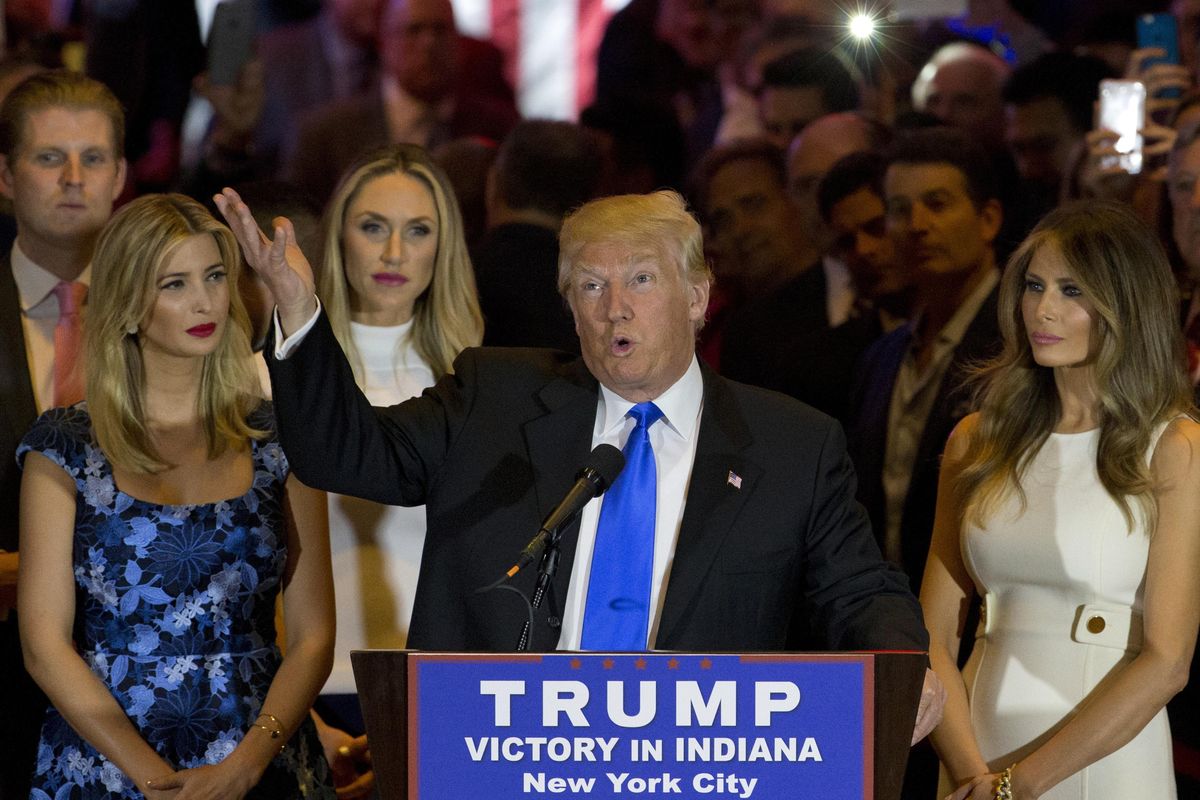 Republican presidential candidate Donald Trump is joined by his wife Melania, right, daughter Ivanka, left, and son Eric, background left, as he speaks during a primary night news conference, Tuesday, May 3, 2016, in New York. (Mary Altaffer / Associated Press)