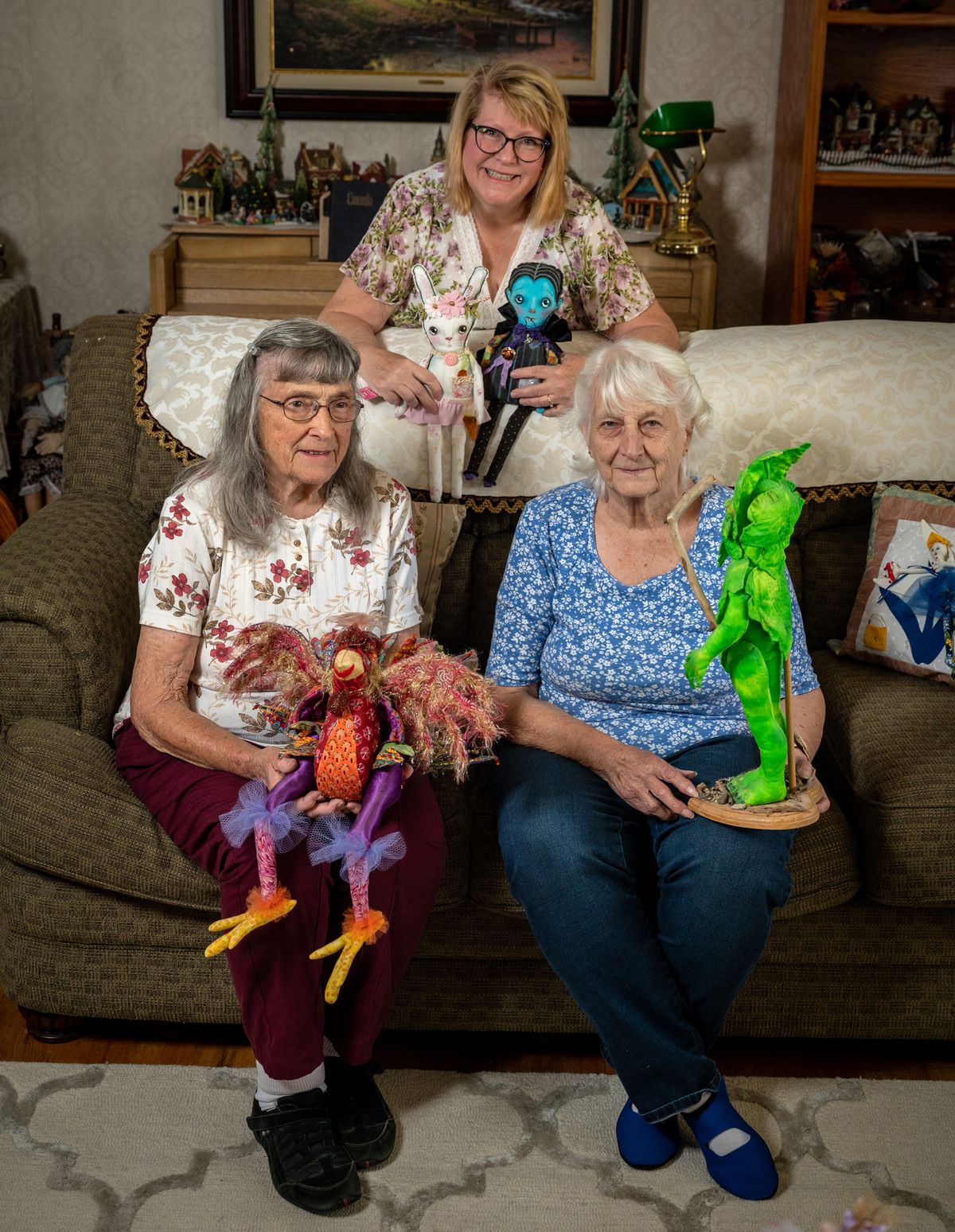 Three of the 14 members of The Doll Club, left to right, Marg Hammond, Carol Vaughn and Shirley Hudson hold dolls they have made. The club meets every month and makes cloth dolls. Sometimes there’s a challenge or a theme, like books, heavy metal, or even chickens.  (COLIN MULVANY/THE SPOKESMAN-REVI)