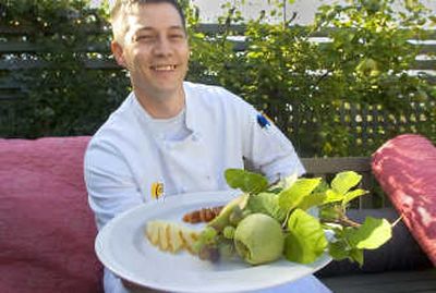 
Luna chef Jeremy Hansen shows off a tray that includes Manchego cheese, paste, grapes and a pineapple quince. 
 (Christopher Anderson / The Spokesman-Review)